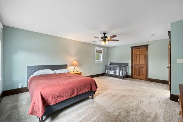 carpeted bedroom with ceiling fan