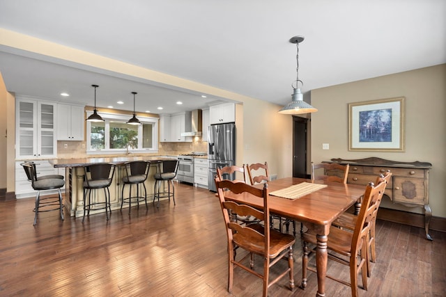 dining area featuring dark hardwood / wood-style flooring