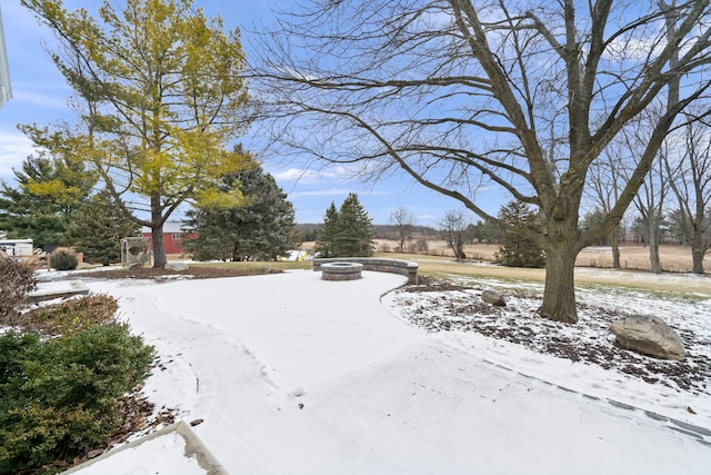 snowy yard with a fire pit