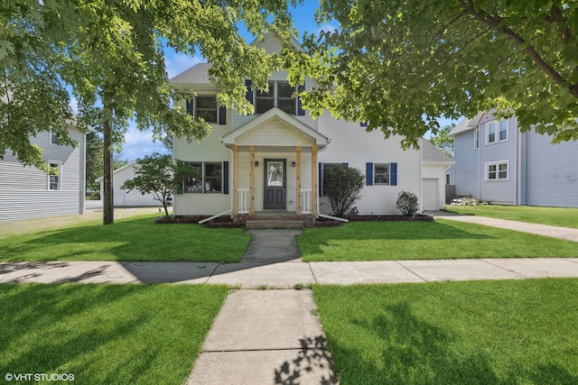 view of front facade with a front yard and a garage