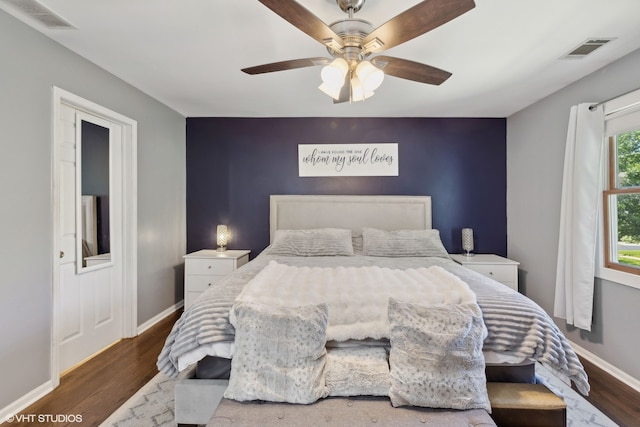 bedroom with dark wood-type flooring and ceiling fan