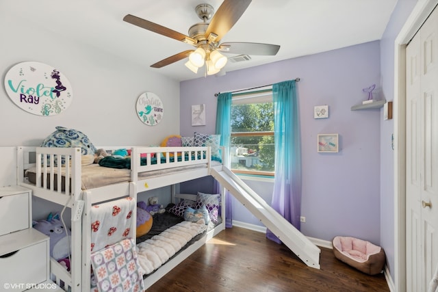 bedroom featuring dark hardwood / wood-style floors, a closet, and ceiling fan