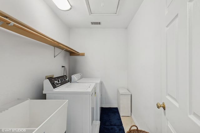 laundry room featuring washer and dryer and sink