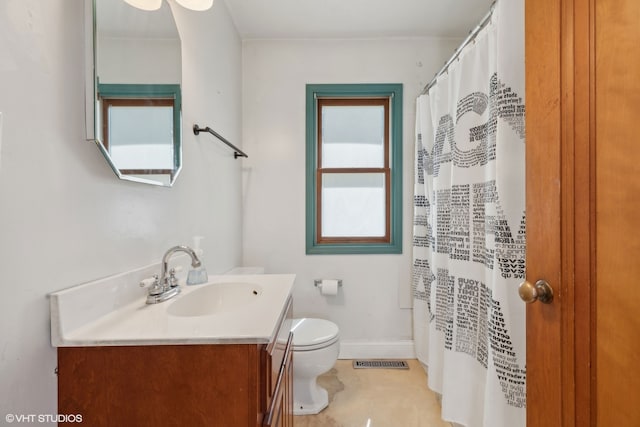 bathroom with toilet and vanity