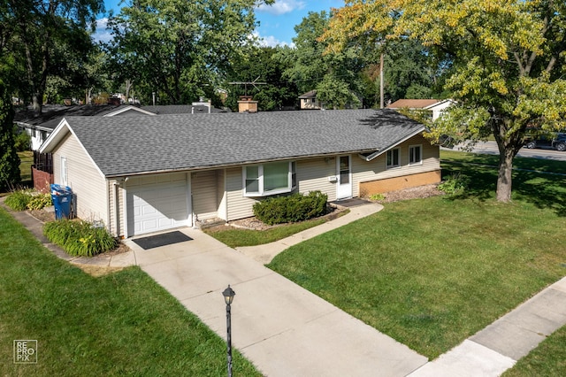 single story home featuring a garage and a front yard