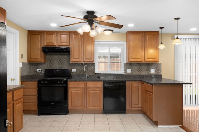 kitchen with black appliances, dark stone counters, backsplash, pendant lighting, and sink