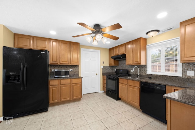 kitchen with black appliances, sink, decorative backsplash, and light tile patterned floors