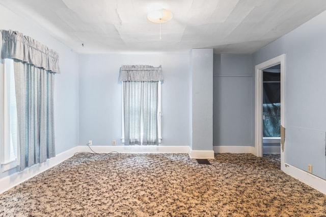 spare room featuring carpet floors