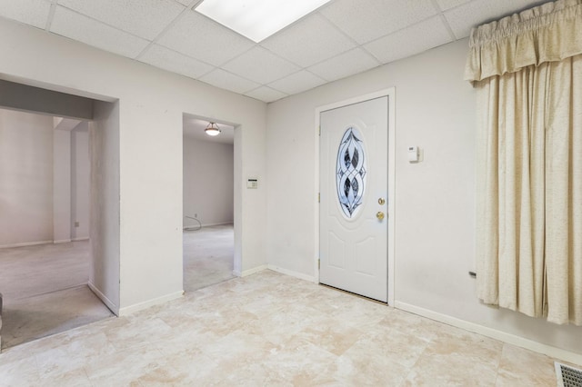 foyer with a drop ceiling