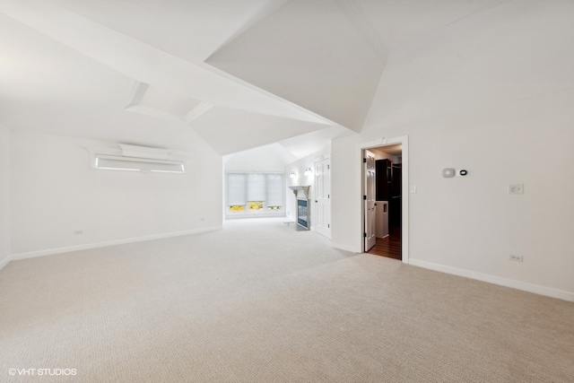 empty room with light carpet and lofted ceiling