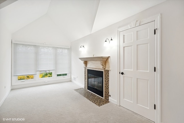 unfurnished living room featuring lofted ceiling and light carpet