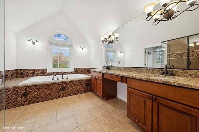 bathroom with vanity, high vaulted ceiling, an inviting chandelier, and tile patterned floors