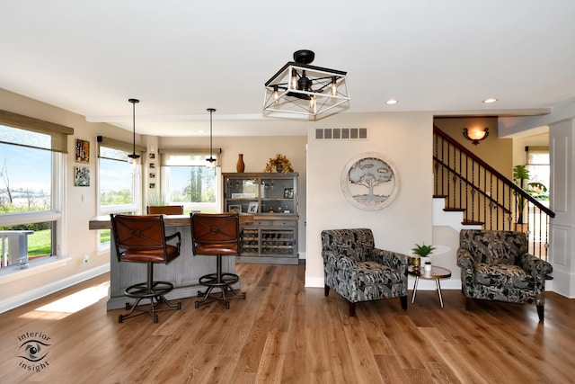 bar featuring hardwood / wood-style flooring