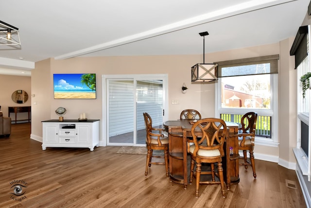 dining area with dark hardwood / wood-style floors