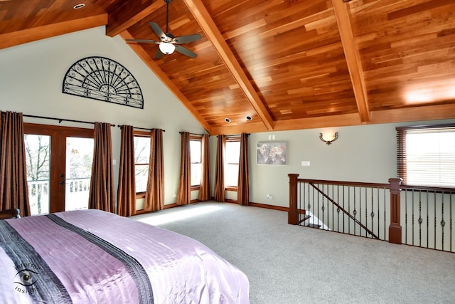 carpeted bedroom with access to outside, multiple windows, ceiling fan, and lofted ceiling with beams