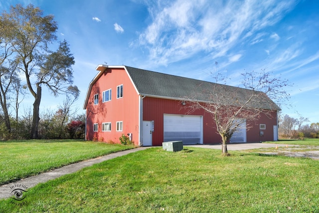 view of front of property featuring a garage and a front lawn