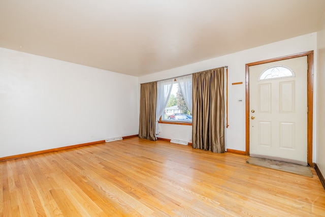 entrance foyer featuring hardwood / wood-style flooring