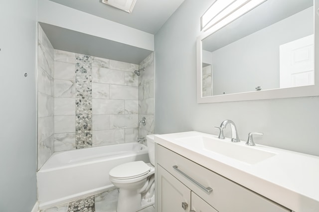 full bathroom with vanity, toilet, and tiled shower / bath