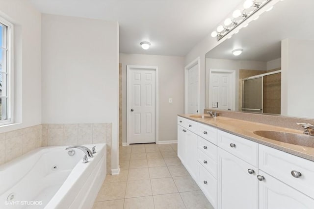 bathroom with tile patterned flooring, vanity, plenty of natural light, and separate shower and tub