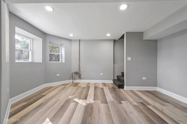 basement featuring light hardwood / wood-style floors