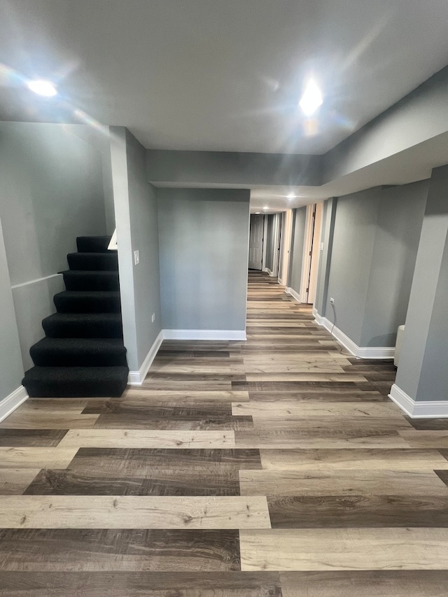 basement featuring dark hardwood / wood-style floors