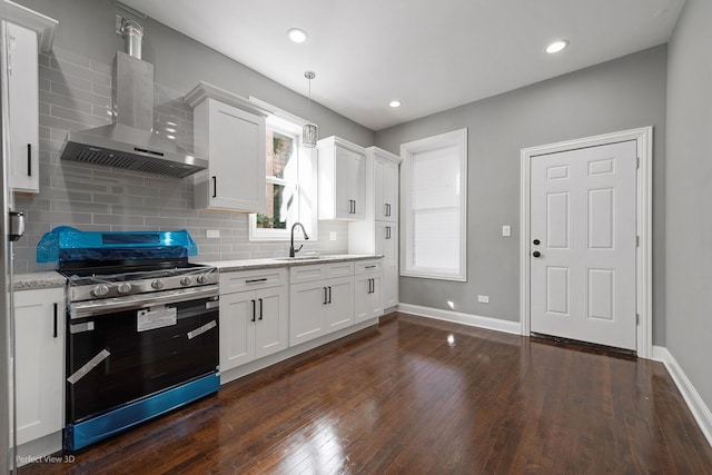 kitchen with white cabinets, decorative light fixtures, stainless steel stove, and dark hardwood / wood-style flooring