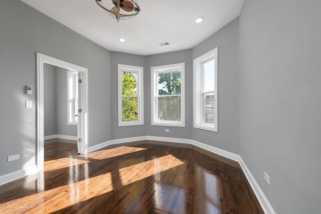 unfurnished room featuring hardwood / wood-style flooring