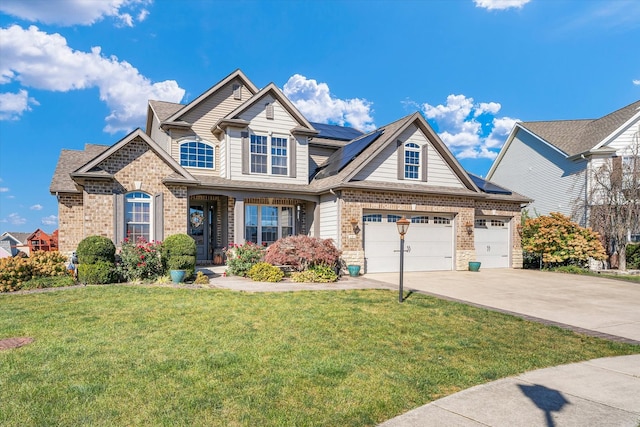 view of front of property with a front yard and a garage