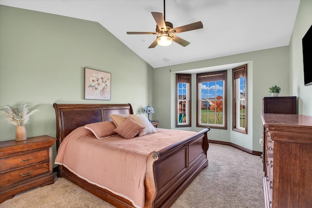 bedroom featuring ceiling fan, light carpet, and lofted ceiling