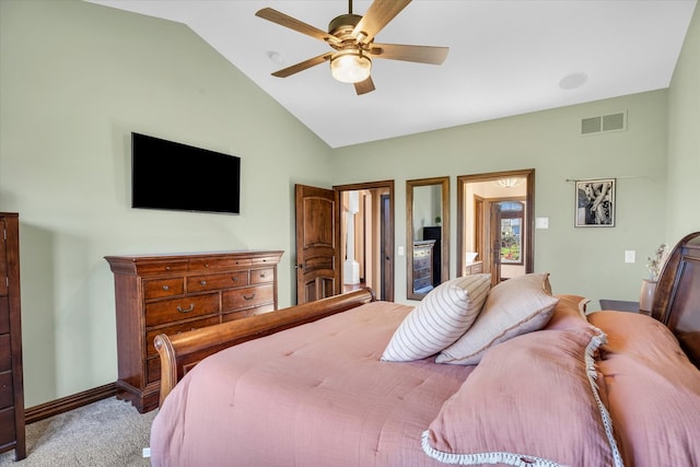 carpeted bedroom featuring vaulted ceiling and ceiling fan