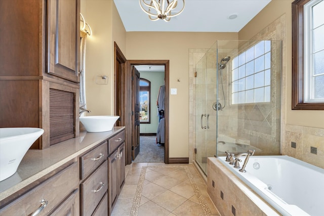 bathroom with vanity, plus walk in shower, an inviting chandelier, and tile patterned flooring