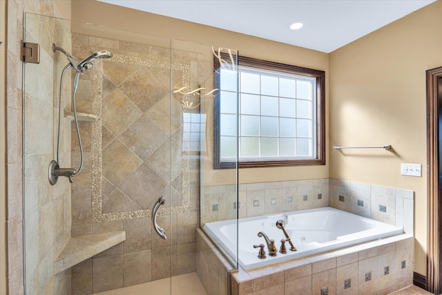 bathroom with separate shower and tub and tile patterned flooring