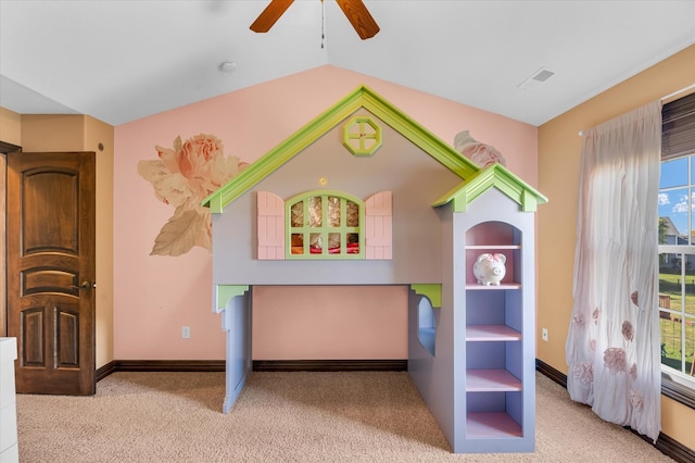 recreation room with ceiling fan, lofted ceiling, and light colored carpet