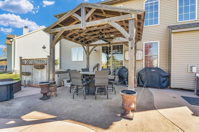 view of patio / terrace featuring a gazebo, ceiling fan, and grilling area