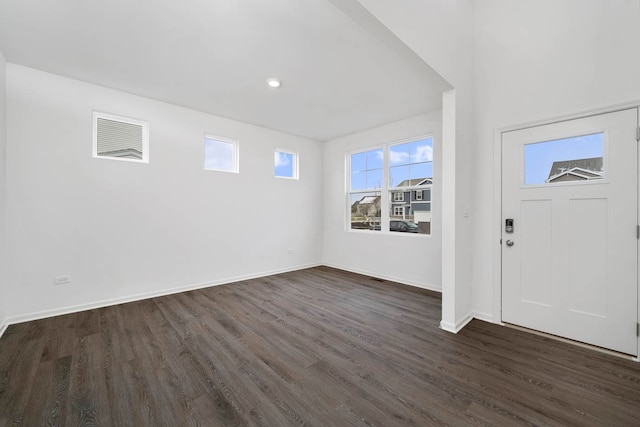 foyer entrance with dark hardwood / wood-style floors