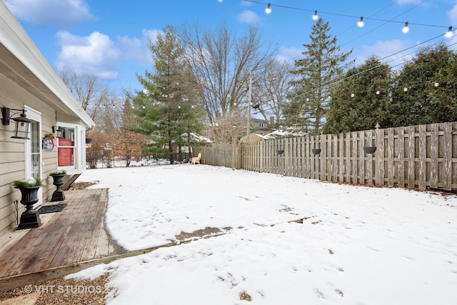 view of yard layered in snow