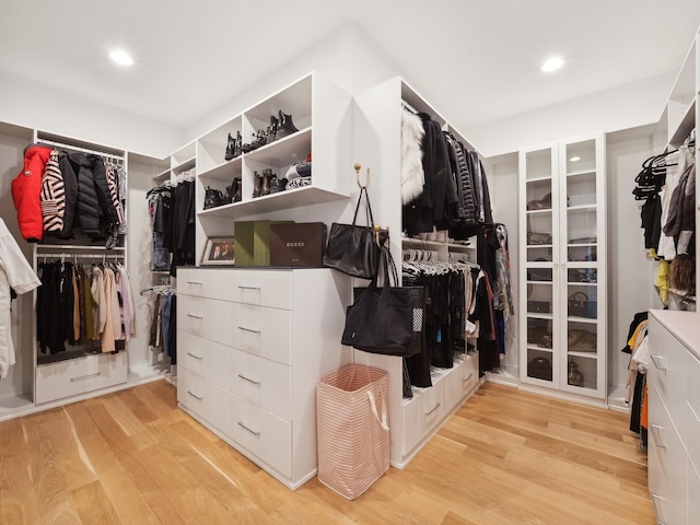 spacious closet featuring light wood-type flooring