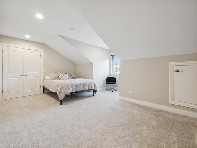 carpeted bedroom featuring vaulted ceiling