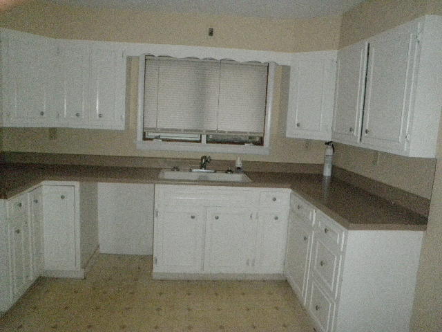 kitchen with sink and white cabinets