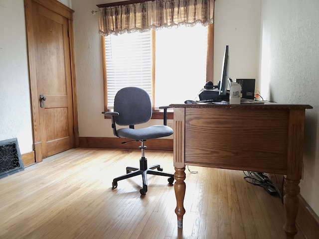 office space with light hardwood / wood-style flooring