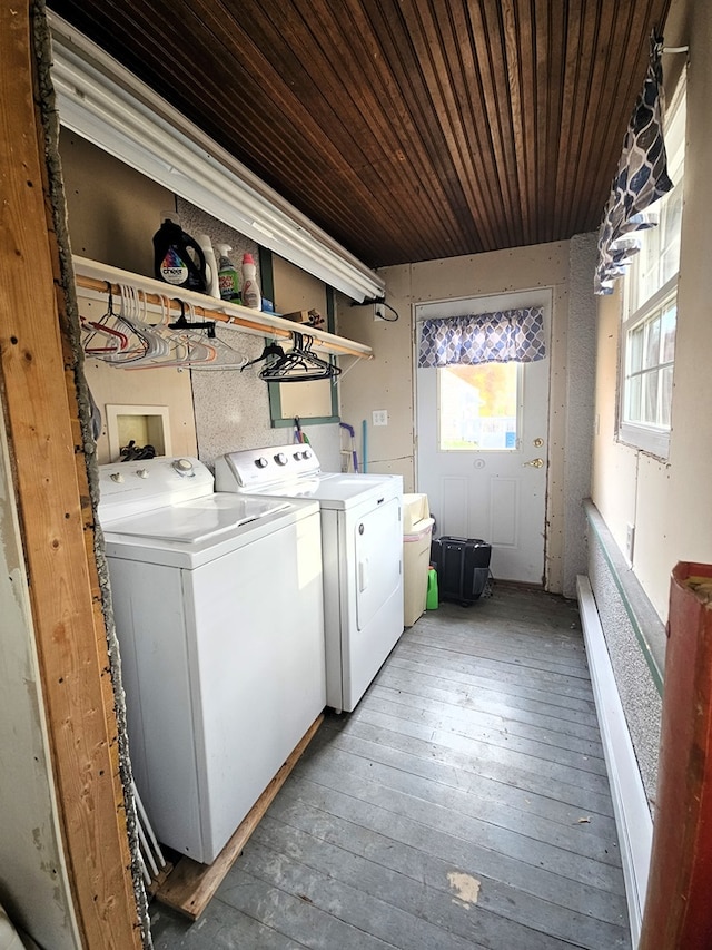 laundry area featuring independent washer and dryer, wooden ceiling, and wood-type flooring