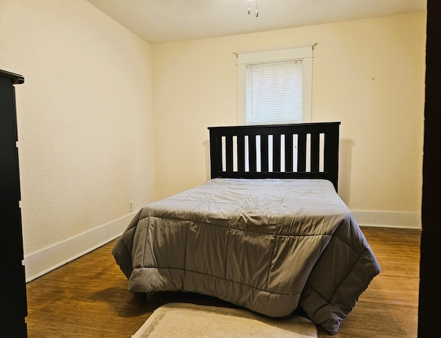 bedroom featuring hardwood / wood-style flooring