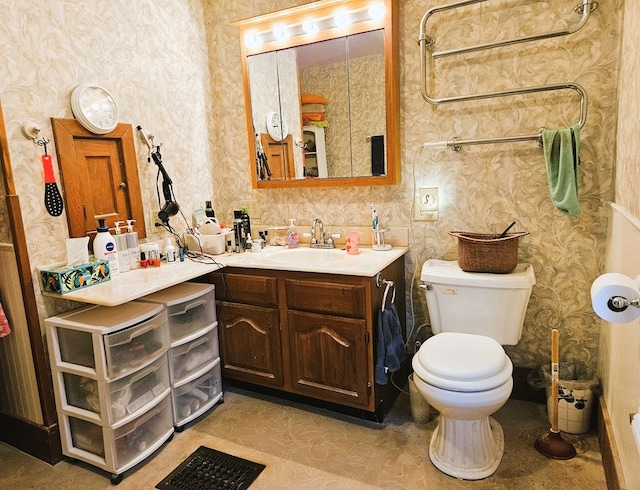 bathroom with toilet and vanity