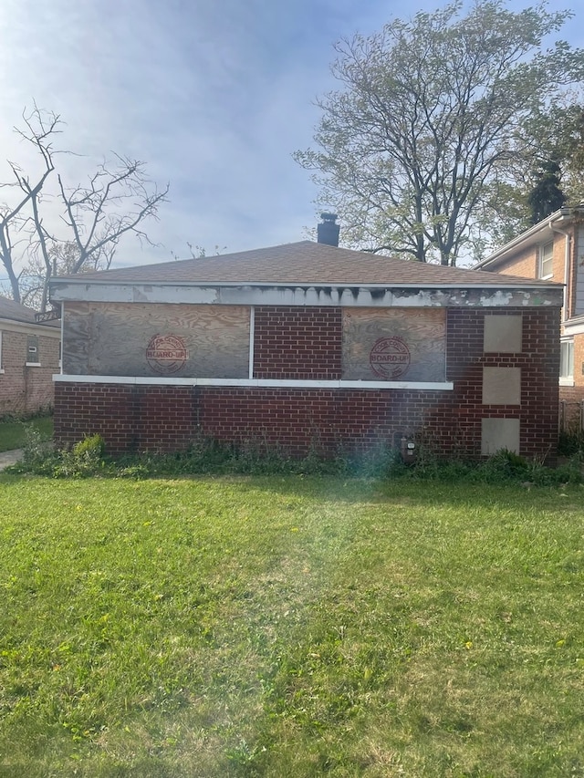 view of home's exterior featuring a lawn