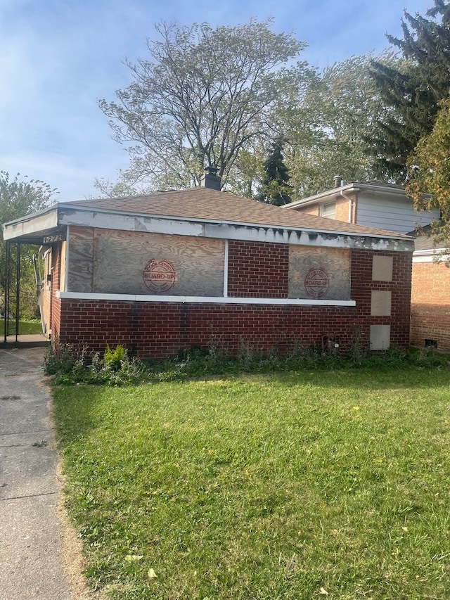 view of home's exterior featuring a yard