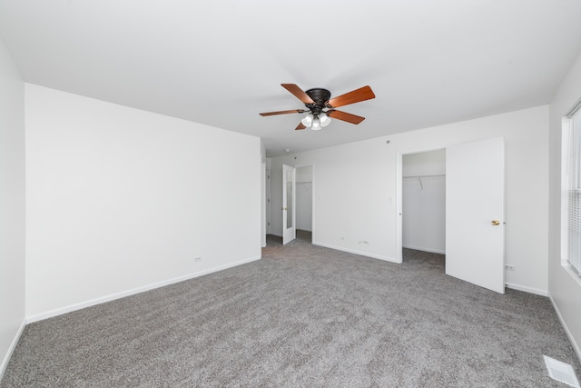 unfurnished bedroom featuring carpet and ceiling fan