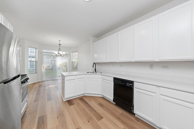 kitchen with a notable chandelier, stainless steel appliances, light wood-type flooring, and white cabinets