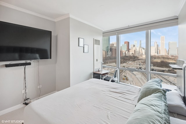 bedroom featuring carpet, ornamental molding, multiple windows, and expansive windows