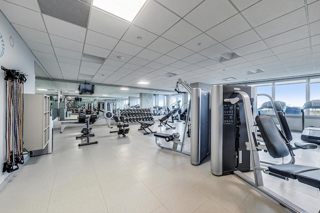 exercise room with a drop ceiling