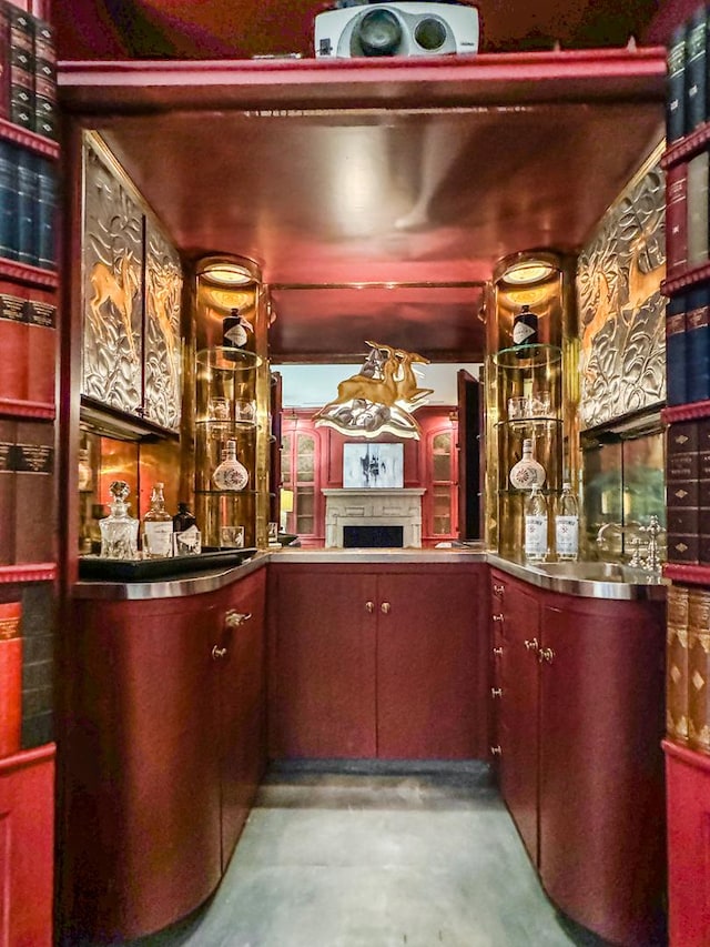 1320 N State Pkwy Unit 14-15Cd, Chicago, IL 60610 - bar with concrete floors, a fireplace, and a sink